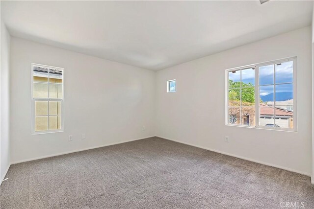 1984 Bronte Rd, San Jacinto, CA 92583 - carpeted empty room featuring baseboards