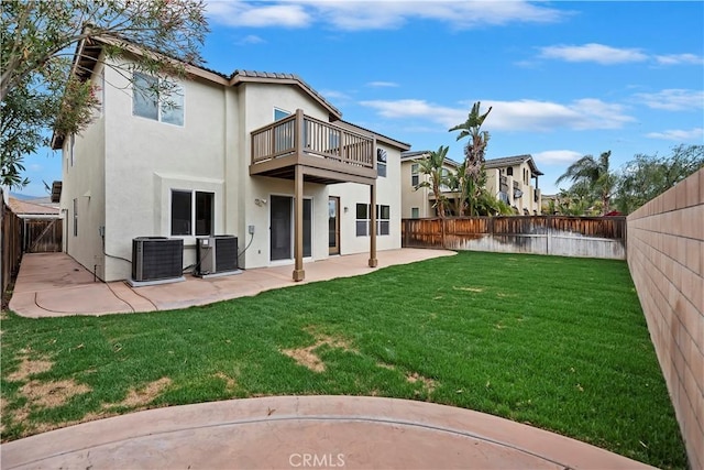 1984 Bronte Rd, San Jacinto, CA 92583 - back of property featuring central air condition unit, a balcony, stucco siding, and a fenced backyard