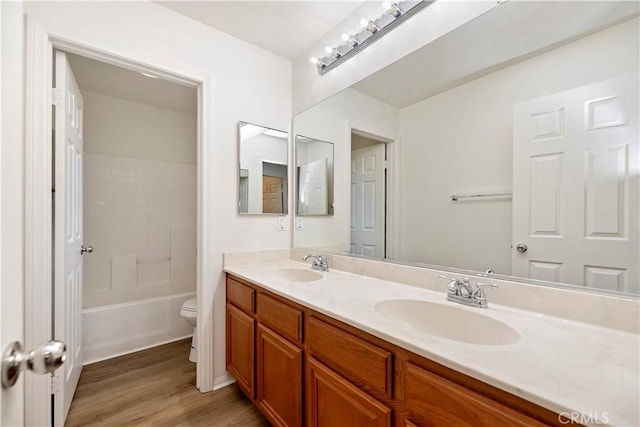 1984 Bronte Rd, San Jacinto, CA 92583 - bathroom featuring double vanity, a sink, toilet, and wood finished floors