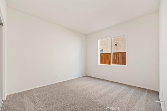 1984 Bronte Rd, San Jacinto, CA 92583 - carpeted empty room featuring baseboards