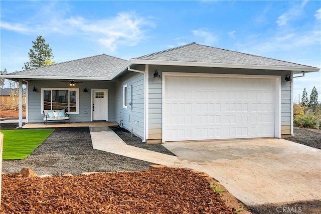 single story home featuring a garage, a ceiling fan, roof with shingles, and concrete driveway