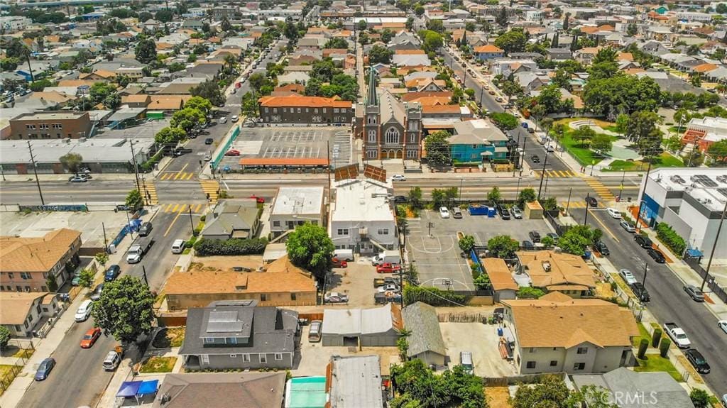 birds eye view of property with a residential view