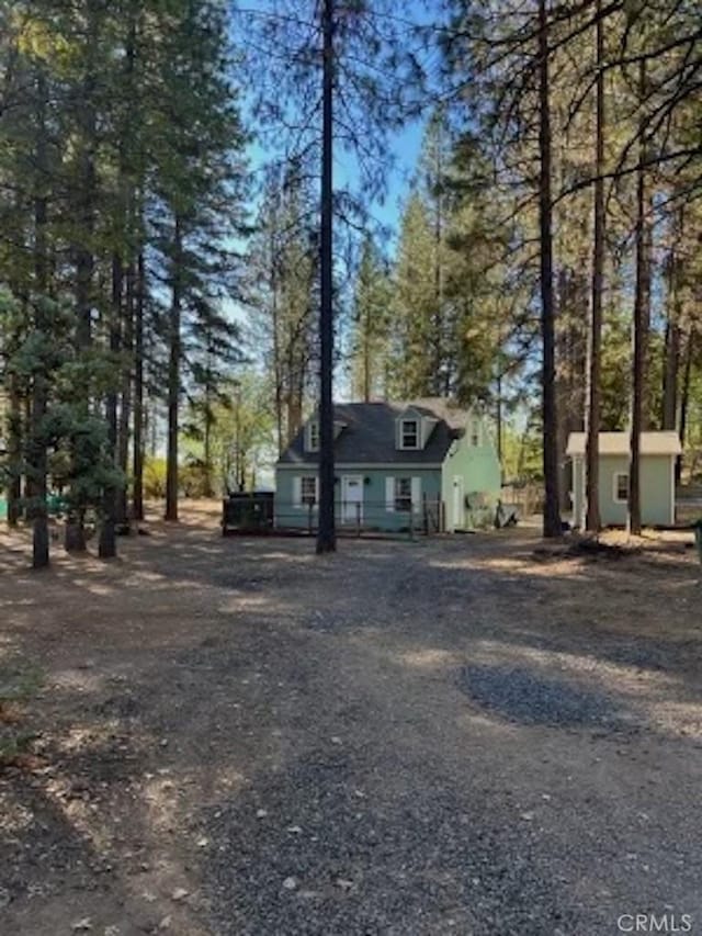 view of front of home featuring an outbuilding and a storage unit