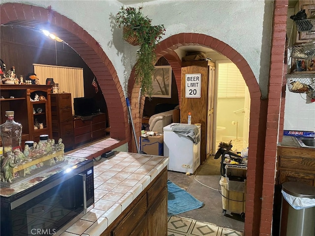 21337 Archibald Ave, Carson, CA 90745 - interior space with arched walkways and a textured wall
