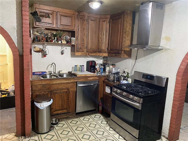 21337 Archibald Ave, Carson, CA 90745 - kitchen featuring arched walkways, open shelves, a sink, stainless steel appliances, and wall chimney exhaust hood