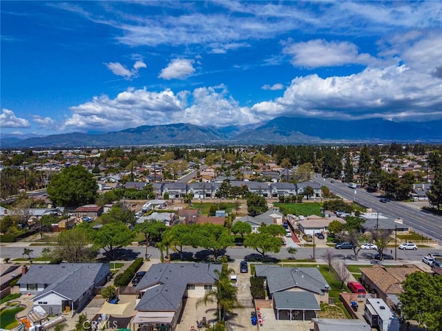 birds eye view of property featuring a mountain view and a residential view