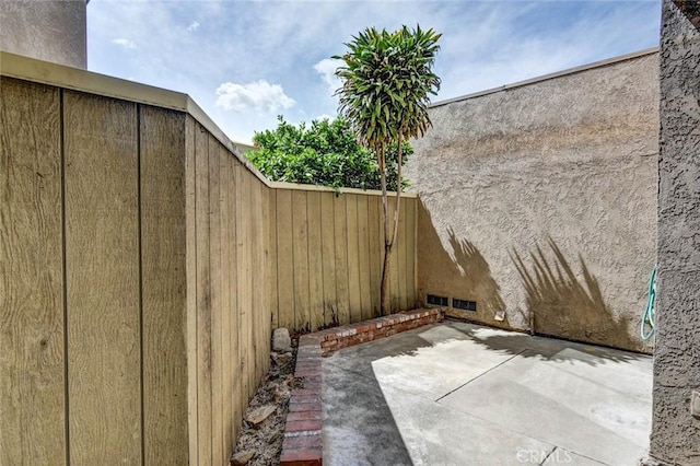view of patio with fence