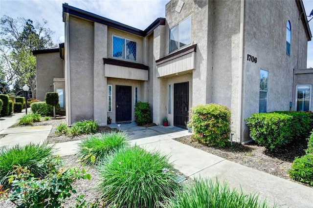 exterior space featuring stucco siding