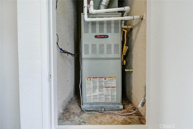utility room with heating unit