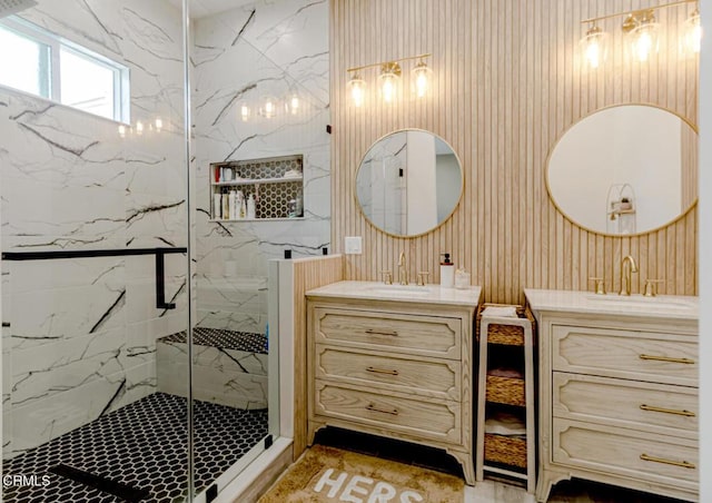 full bathroom with a sink, a marble finish shower, and two vanities