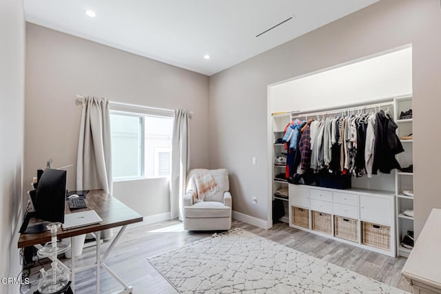 office featuring recessed lighting, baseboards, and light wood-type flooring