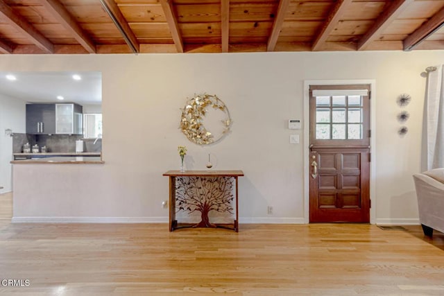 entrance foyer featuring wooden ceiling, baseboards, beam ceiling, and light wood-style flooring