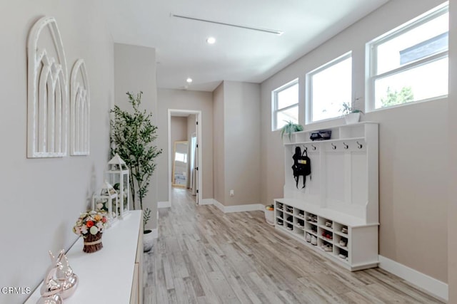 mudroom featuring recessed lighting, baseboards, and light wood-type flooring