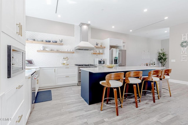 kitchen with decorative backsplash, a kitchen island, open shelves, stainless steel appliances, and wall chimney exhaust hood