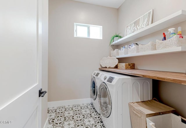 laundry area featuring laundry area, baseboards, and washer and dryer
