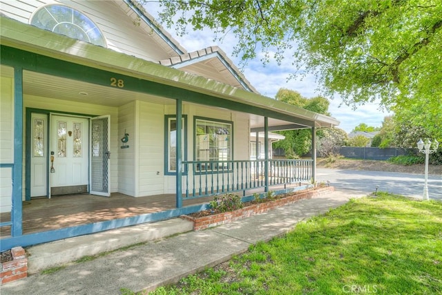 doorway to property with a porch