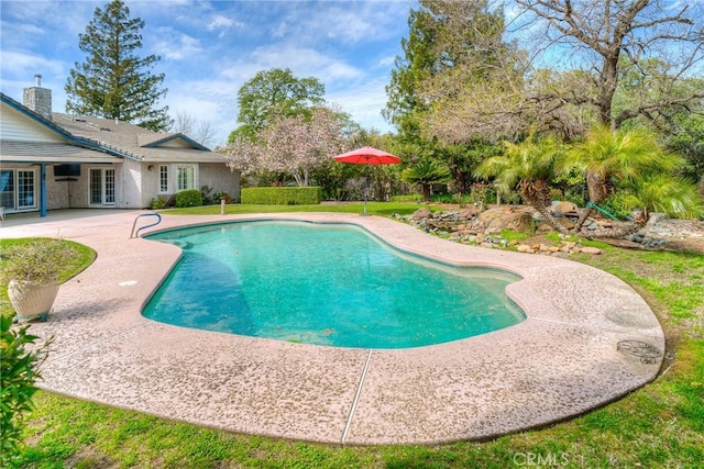 pool featuring a patio area