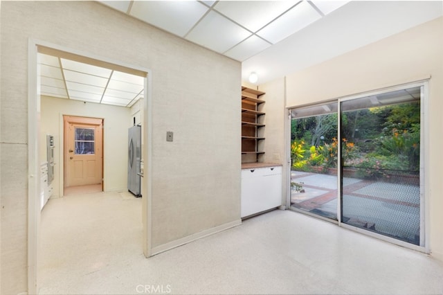 spare room with a drop ceiling