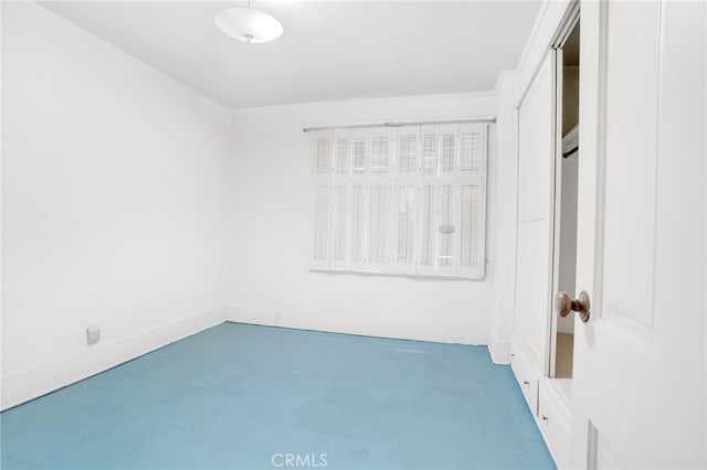 unfurnished room with finished concrete floors