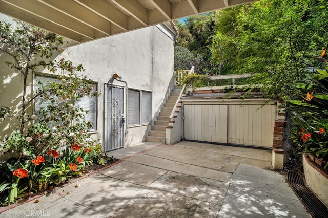 view of patio with stairway