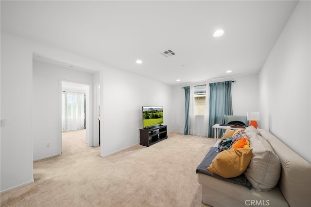 carpeted living room featuring visible vents and recessed lighting
