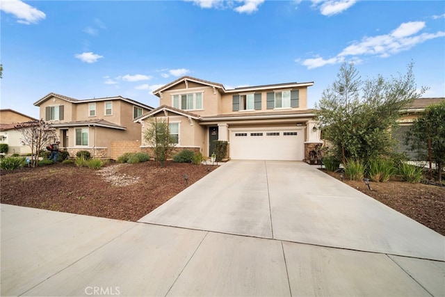craftsman inspired home featuring stucco siding, a garage, stone siding, and concrete driveway