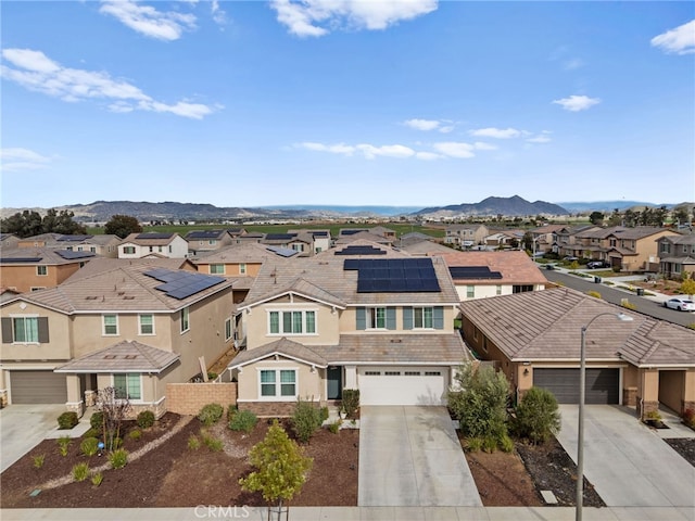 bird's eye view featuring a mountain view and a residential view