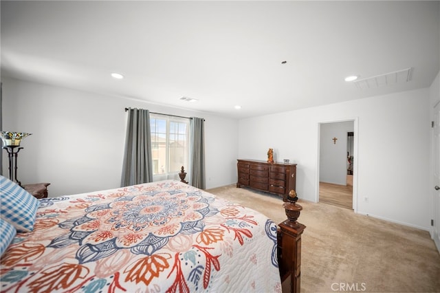 bedroom with light colored carpet, visible vents, baseboards, and recessed lighting