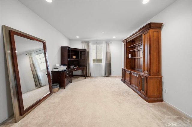 home office featuring light carpet, a wealth of natural light, and recessed lighting