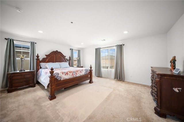 bedroom featuring baseboards, visible vents, recessed lighting, and light colored carpet