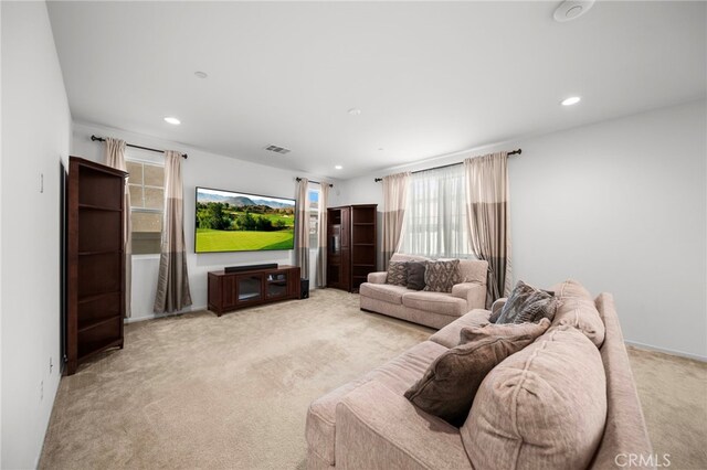 living area featuring recessed lighting and carpet flooring