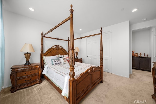 bedroom featuring light colored carpet and recessed lighting