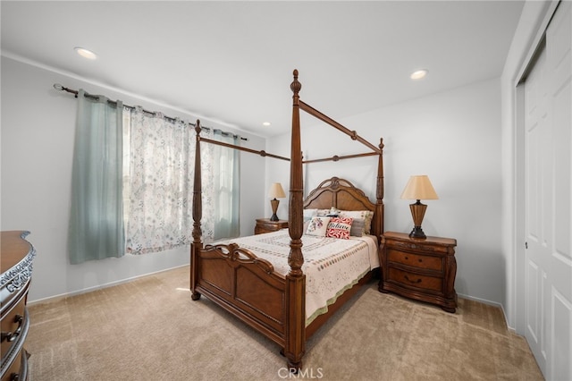 carpeted bedroom featuring a closet and recessed lighting