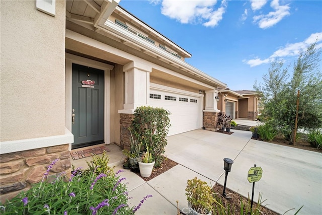 entrance to property featuring stucco siding and stone siding