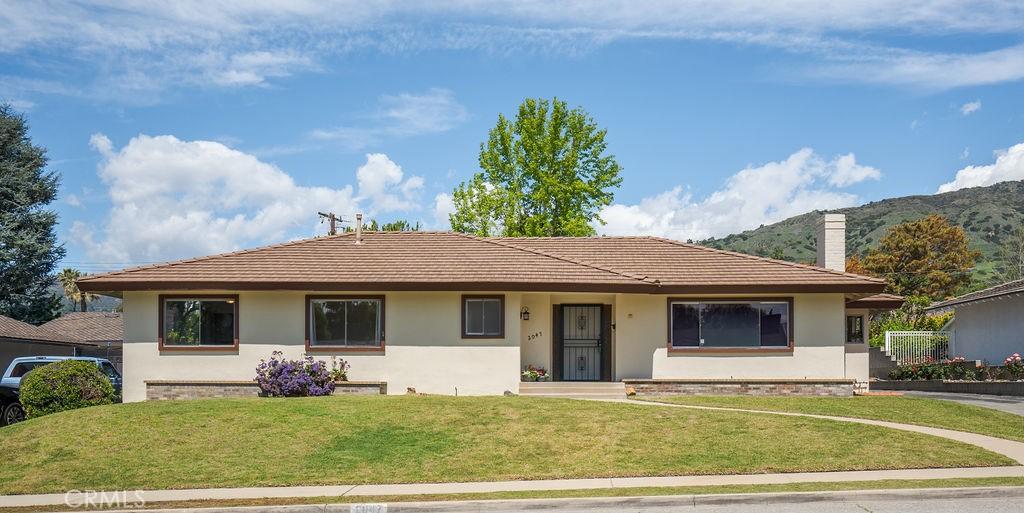 2047 Pinehurst St, Glendora, CA 91741 - single story home with a front lawn, a chimney, stucco siding, and a tile roof
