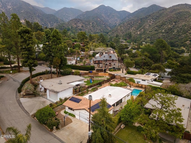 birds eye view of property with a mountain view