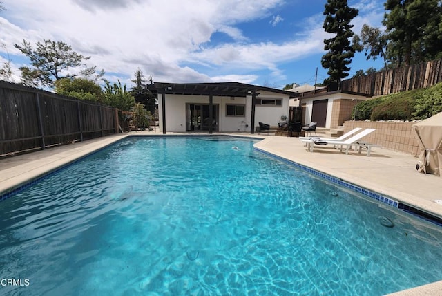 view of swimming pool featuring fence private yard, a patio area, and a fenced in pool