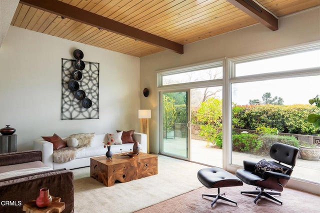 carpeted living area featuring wooden ceiling and beamed ceiling