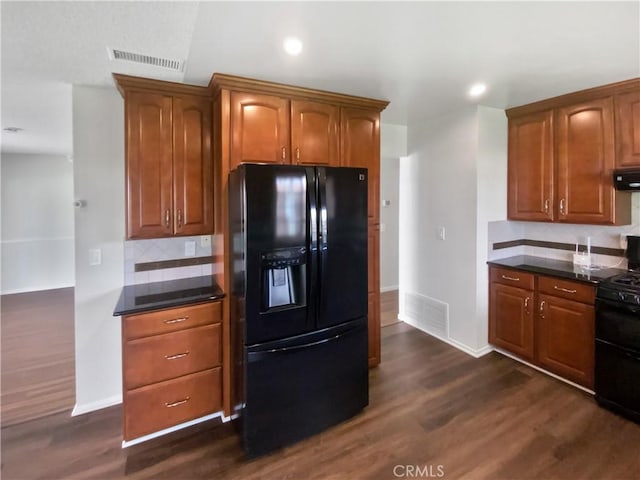 4739 Belmont Pl, Chino, CA 91710 - kitchen featuring black appliances, dark countertops, decorative backsplash, dark wood-style flooring, and recessed lighting