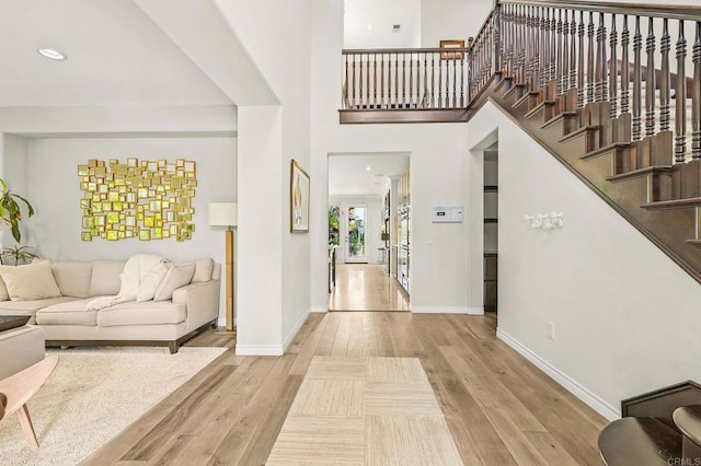 6497 Wayfinders Ct, Carlsbad, CA 92011 - entryway featuring wood finished floors, stairs, and recessed lighting