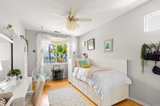 6497 Wayfinders Ct, Carlsbad, CA 92011 - bedroom featuring light wood finished floors and ceiling fan