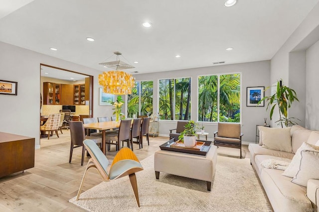 6497 Wayfinders Ct, Carlsbad, CA 92011 - living area with recessed lighting, light wood-type flooring, and a chandelier