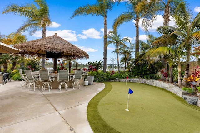 6497 Wayfinders Ct, Carlsbad, CA 92011 - fenced backyard with a putting area and a patio