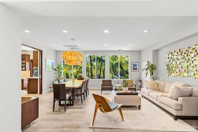 6497 Wayfinders Ct, Carlsbad, CA 92011 - living area with light wood-type flooring, a chandelier, and recessed lighting