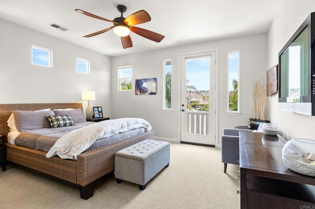 6497 Wayfinders Ct, Carlsbad, CA 92011 - bedroom featuring access to exterior, a ceiling fan, and light carpet