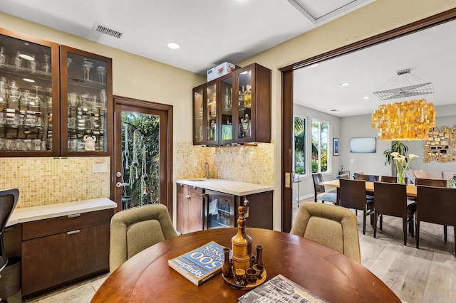 6497 Wayfinders Ct, Carlsbad, CA 92011 - dining room with beverage cooler, recessed lighting, and light wood finished floors