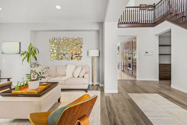 6497 Wayfinders Ct, Carlsbad, CA 92011 - living area featuring wood finished floors and recessed lighting