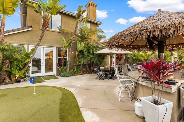 6497 Wayfinders Ct, Carlsbad, CA 92011 - view of patio / terrace with a putting green and a bar