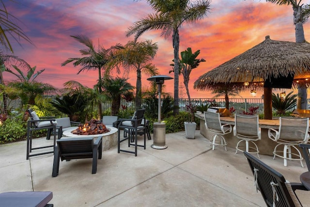 6497 Wayfinders Ct, Carlsbad, CA 92011 - patio terrace at dusk with a patio area and a fire pit