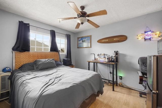 3168 Florine Dr, Lemon Grove, CA 91945 - bedroom featuring light wood-style flooring, a textured ceiling, and ceiling fan